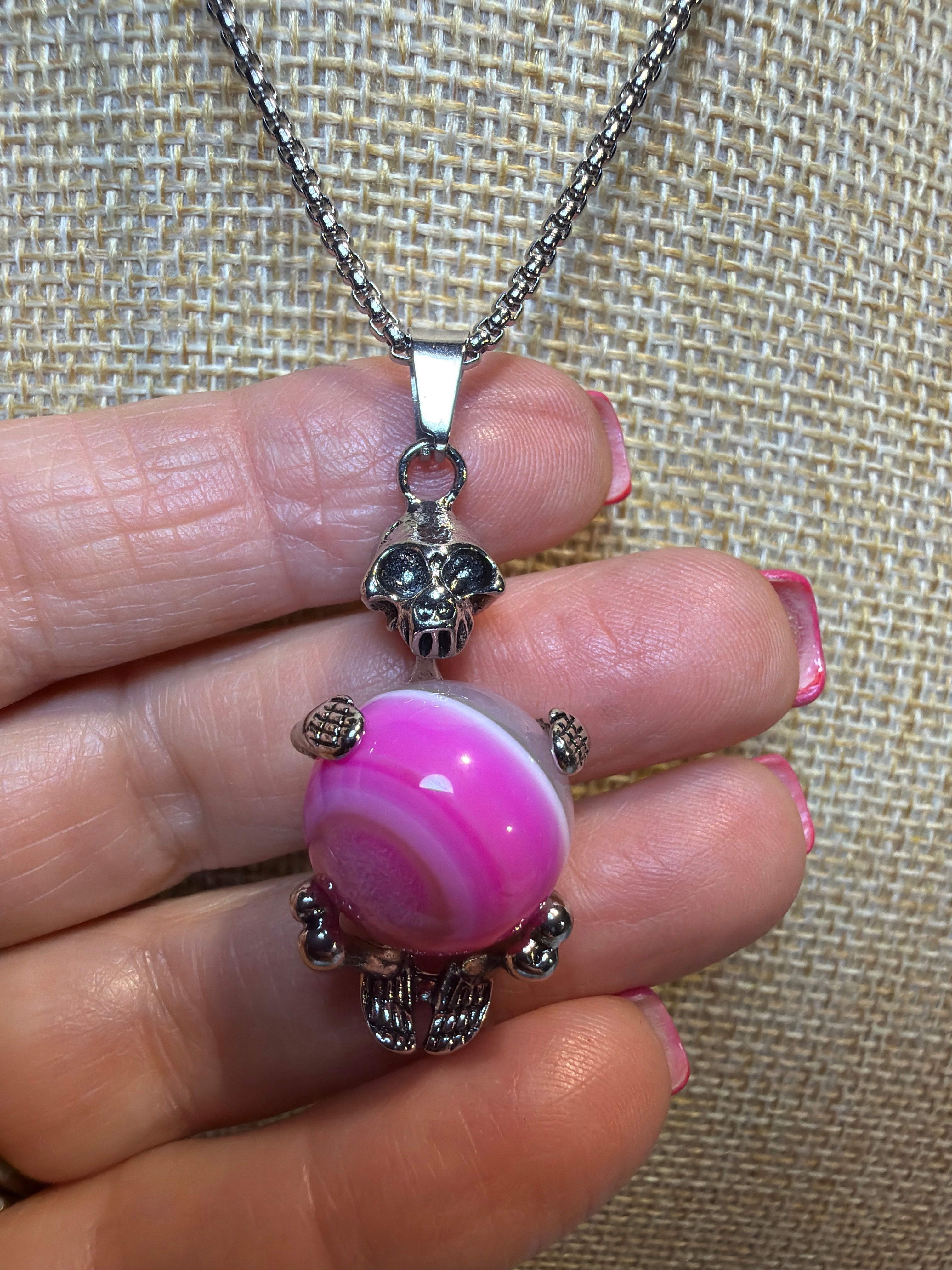 SKELETON ON PINK GLASS SWIRL BALL NECKLACE
