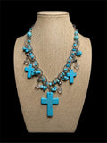 TURQUOISE COLORED CROSS NECKLACE