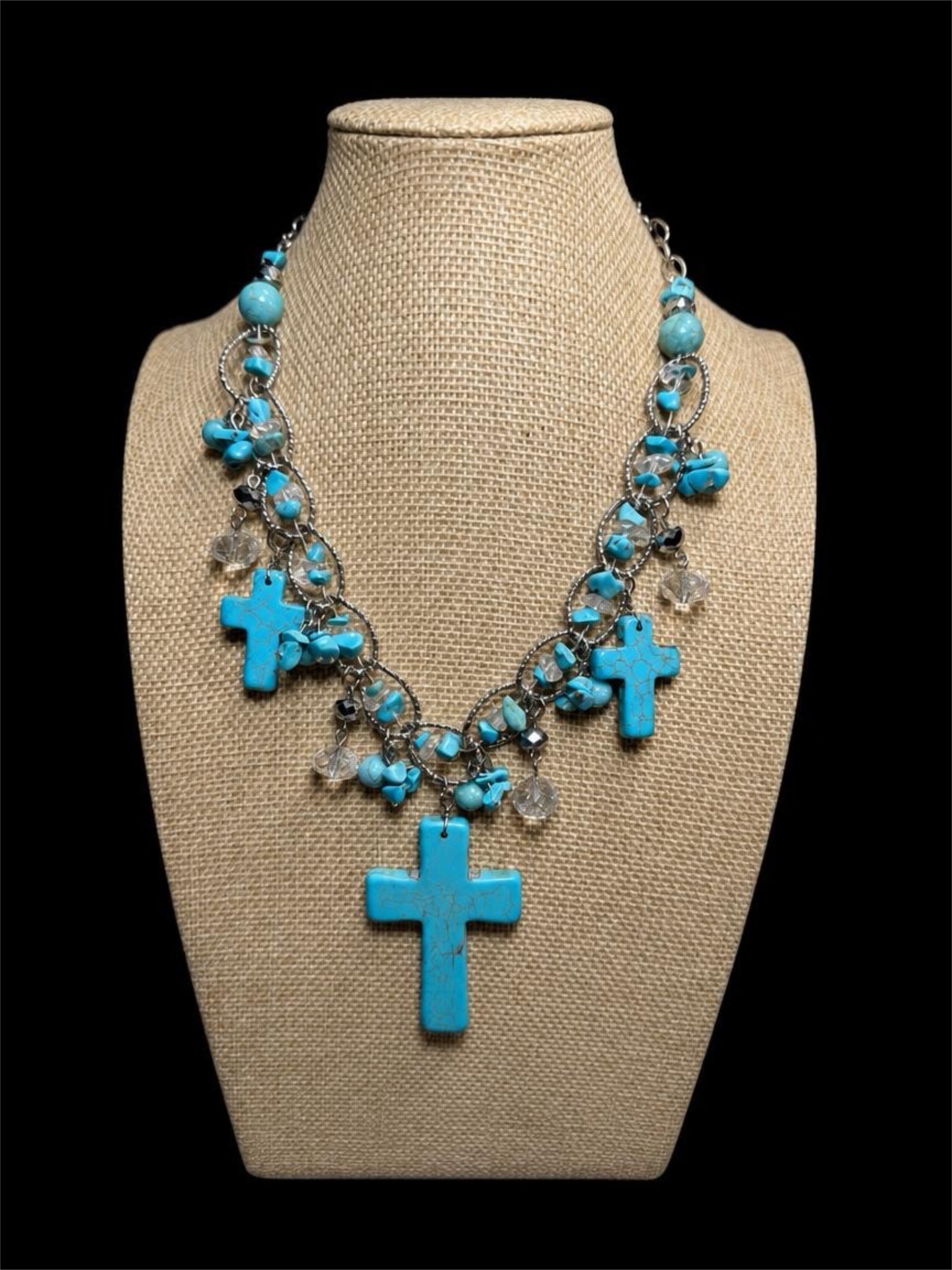 TURQUOISE COLORED CROSS NECKLACE