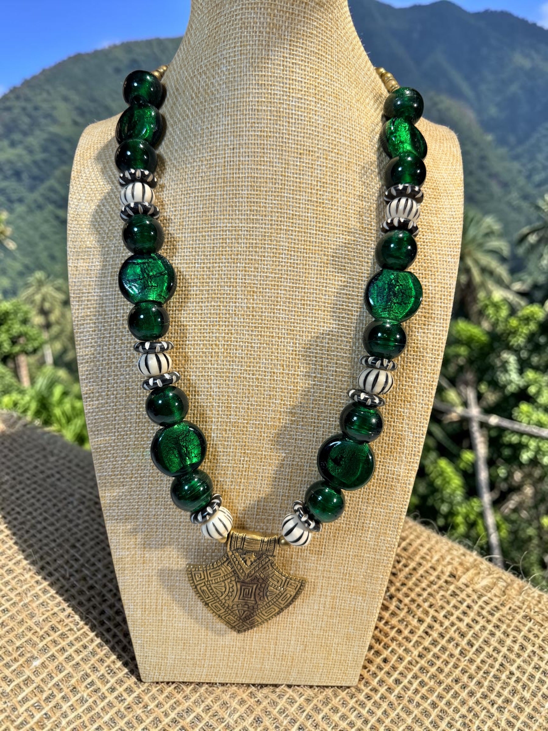 OVERSIZED GLASS BEAD NECKLACE WITH BRASS SPEAR POINT PENDANT