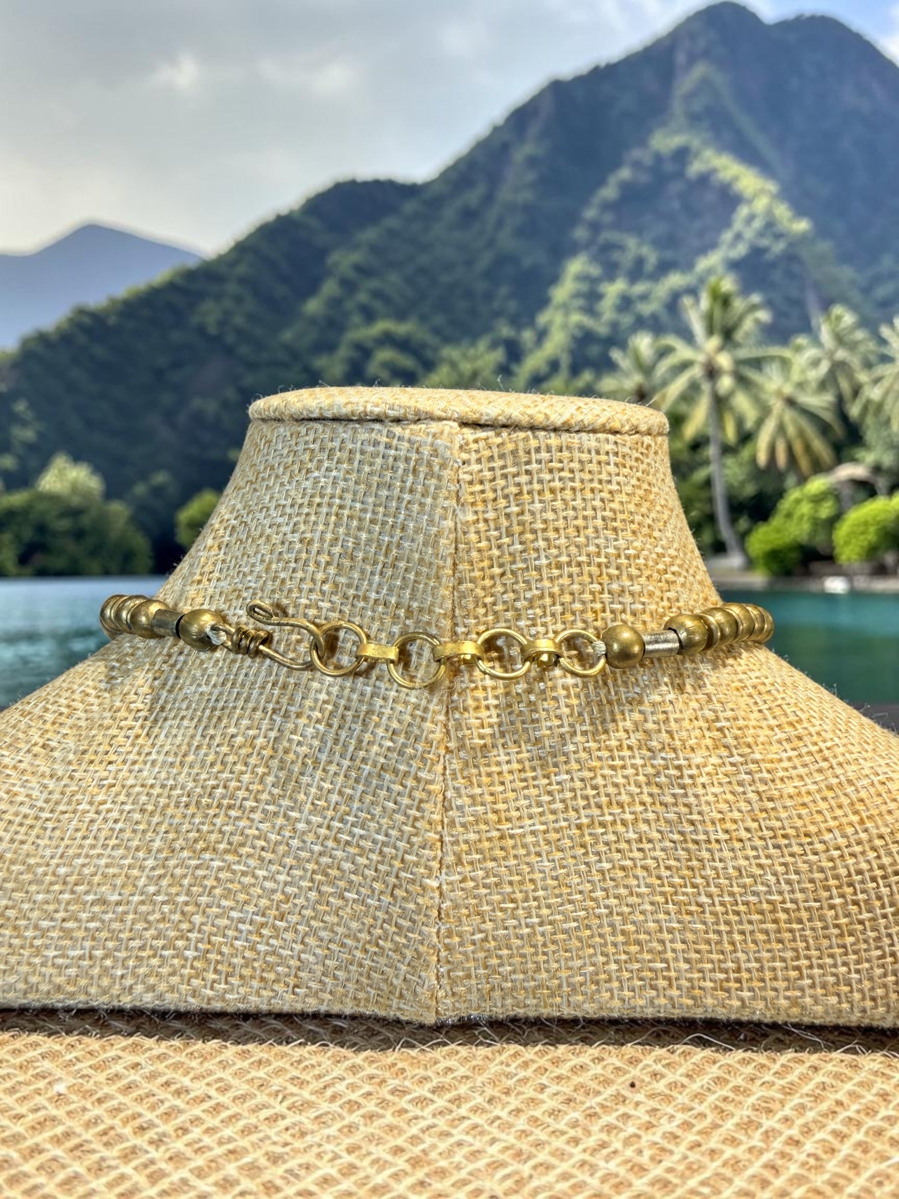 OVERSIZED GLASS BEAD NECKLACE WITH BRASS SPEAR POINT PENDANT