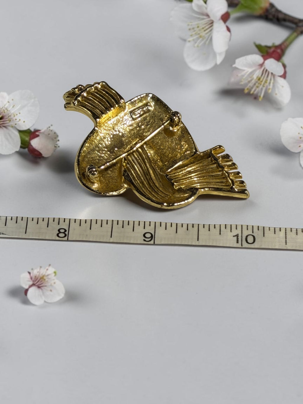 A.J.C. GOLD TONE FLYING HEART BROOCH