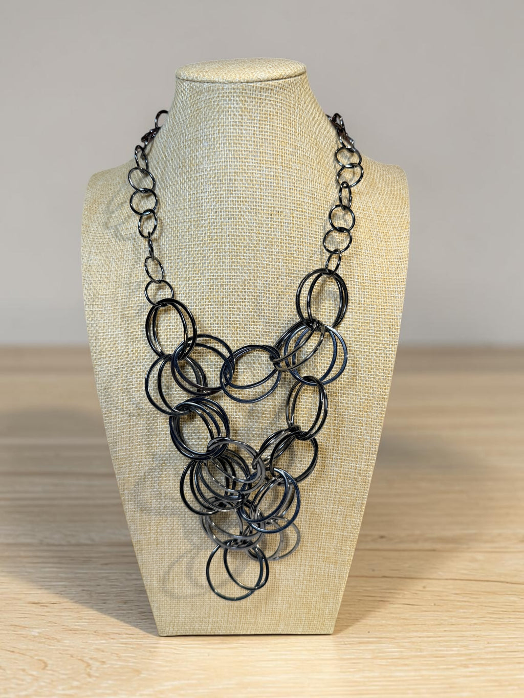 RINGS, RINGS, AND MORE RINGS IN THIS BLACK METAL NECKLACE
