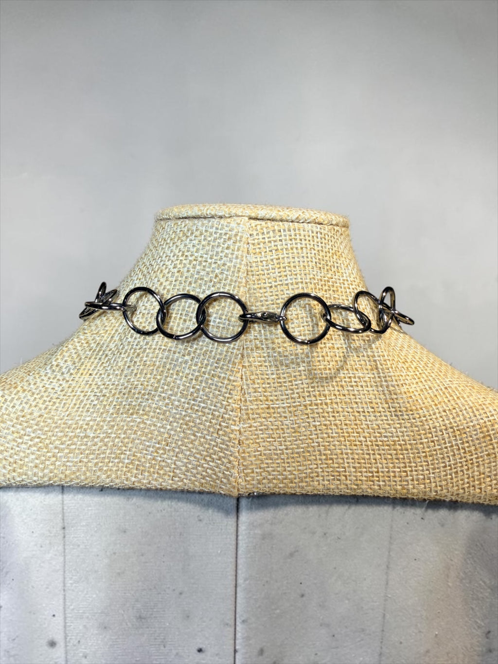 RINGS, RINGS, AND MORE RINGS IN THIS BLACK METAL NECKLACE
