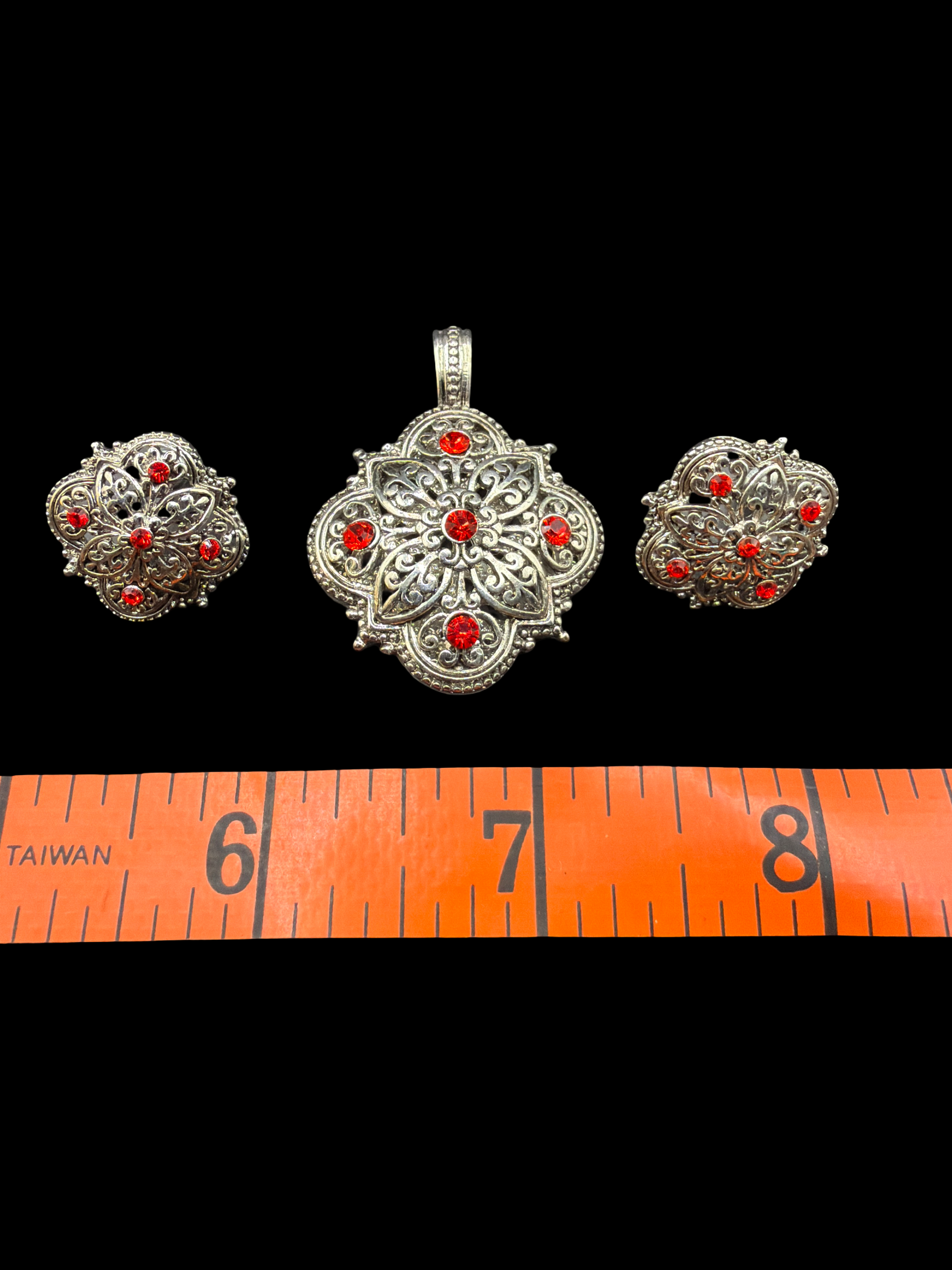 SILVER TONE AND RED RHINESTONE PENDANT AND EARRINGS SET