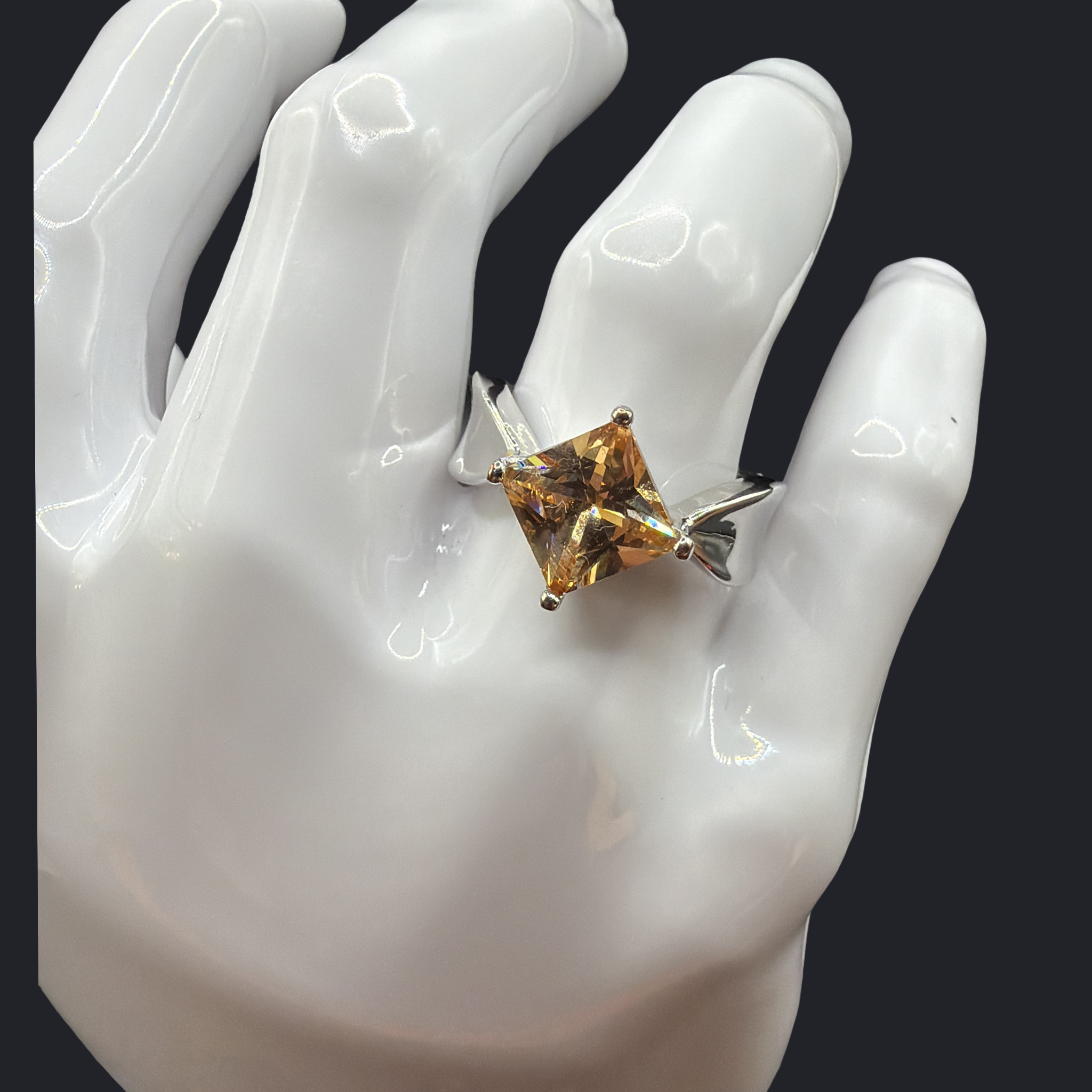 SQUARE CUT ORANGE COLORED STONE