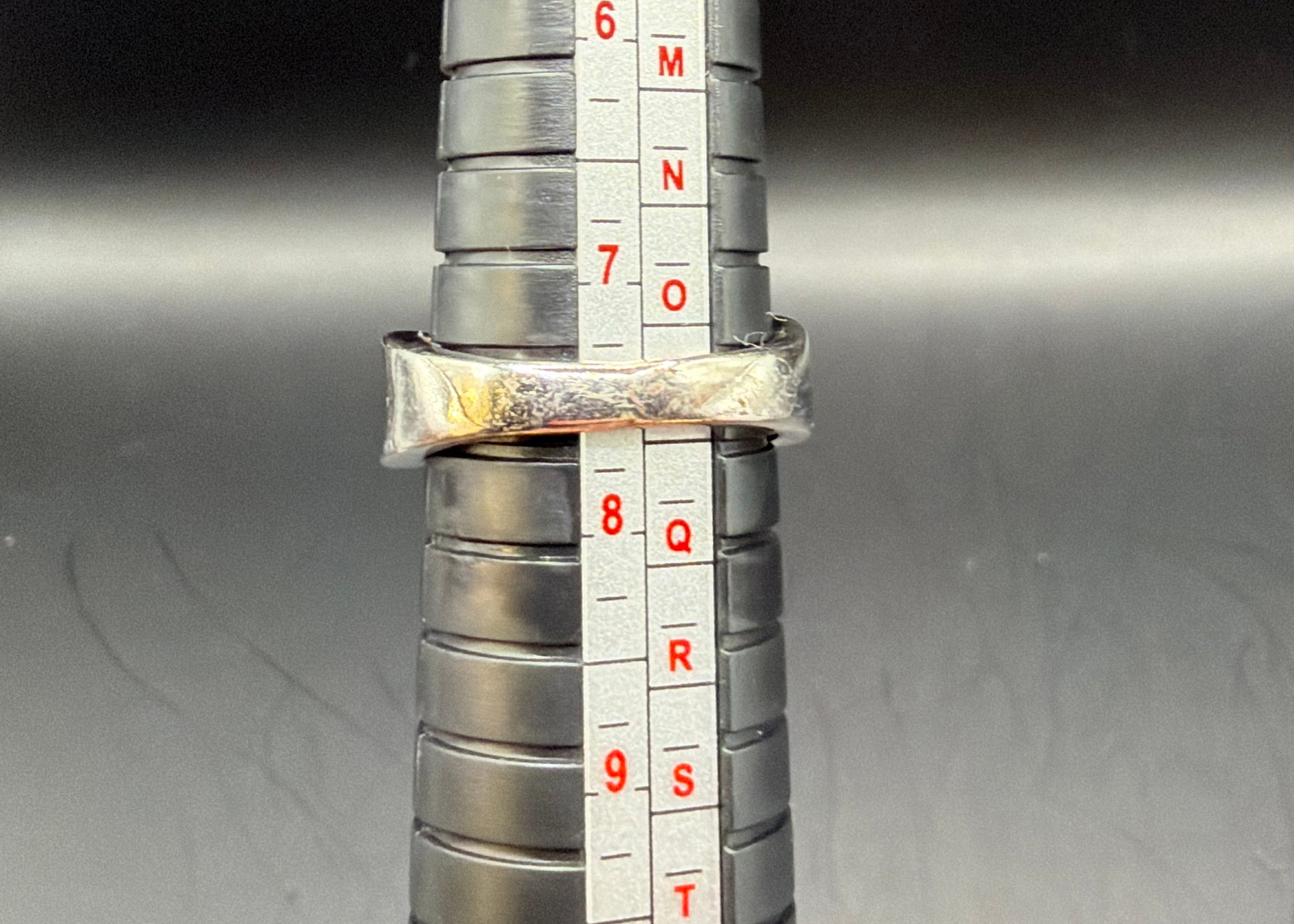 SQUARE CUT ORANGE COLORED STONE