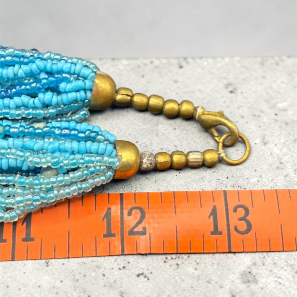 BLUE BEADS AND BRONZE TONE NECKLACE
