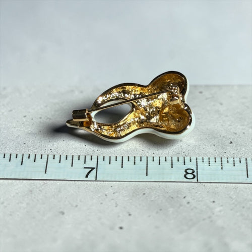 "THE TOOTH, THE WHOLE TOOTH, AND NOTHING BUT THE TOOTH". BROOCH